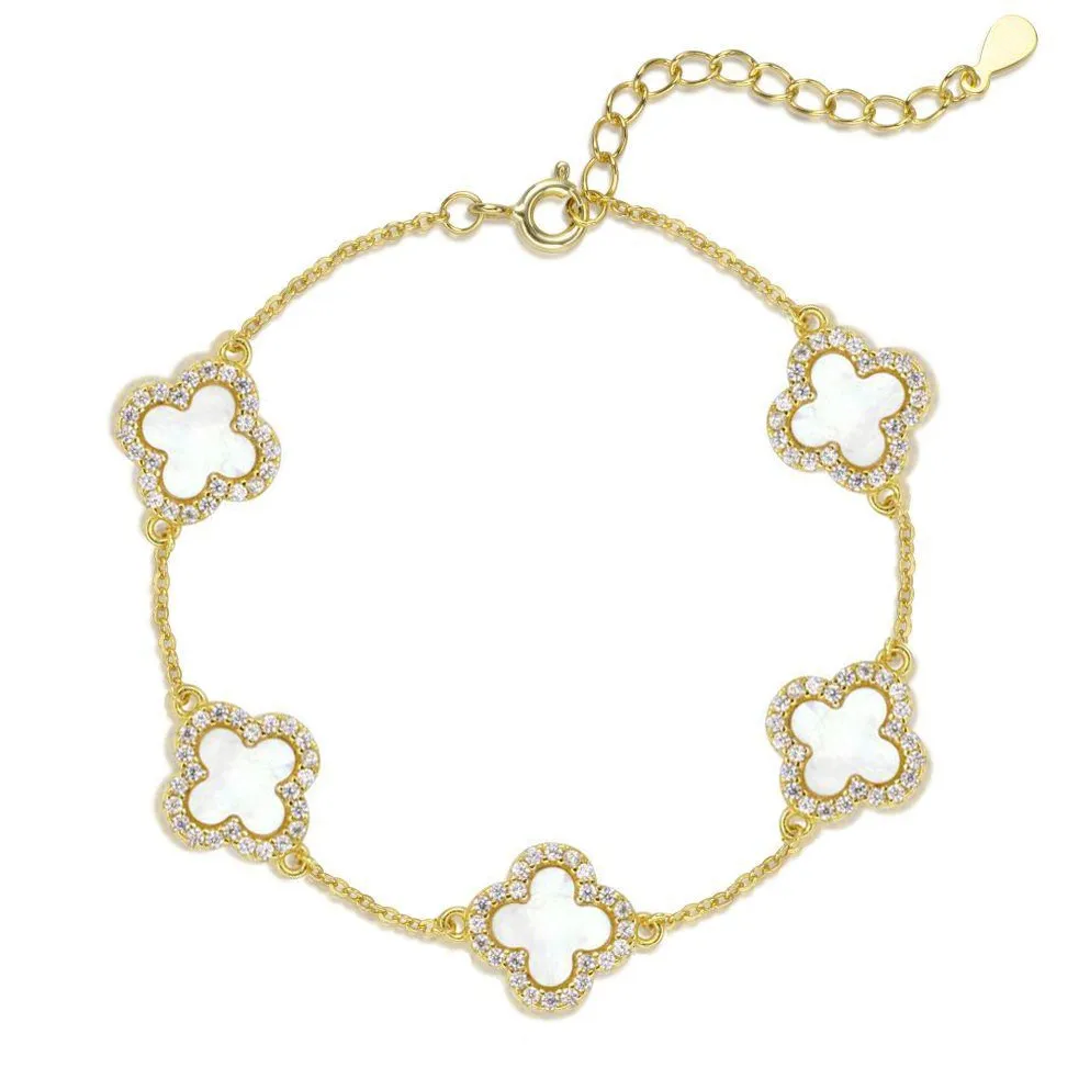 Gold bracelet with clover-shaped links on a white background